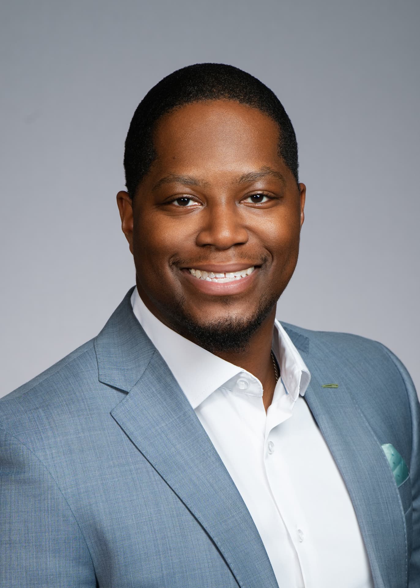 Jamel Mitchum, Co-Founder and Managing Partner of Mitswish, in a modern office lobby